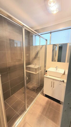 Shower, towels, soap, toilet paper