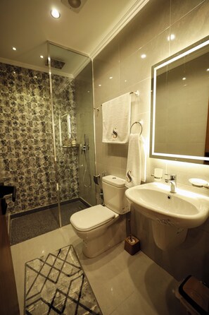 Separate tub and shower, hair dryer, towels, soap