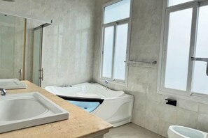 Shower, towels, soap, toilet paper