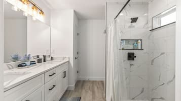 Shower, towels, soap, toilet paper