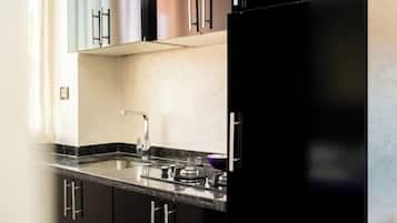 Microwave, stovetop, coffee/tea maker, coffee grinder