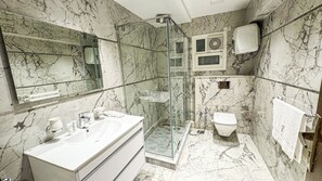 Shower, slippers, towels, soap