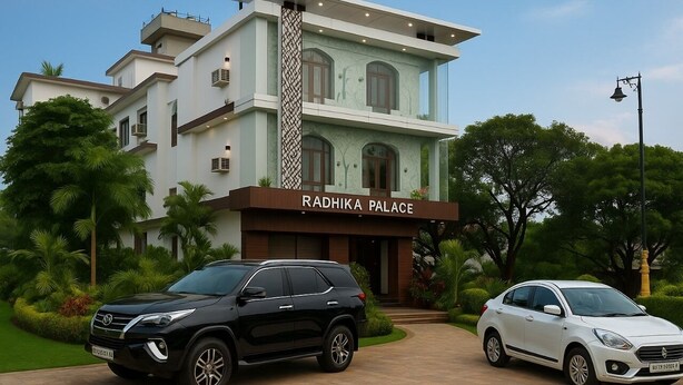 A modern building labeled "Radhika Palace" with a black and white car parked in front. - Minx Hotels Radhika Palace (Ayodhya)