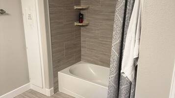 Jetted tub, hair dryer, towels, soap