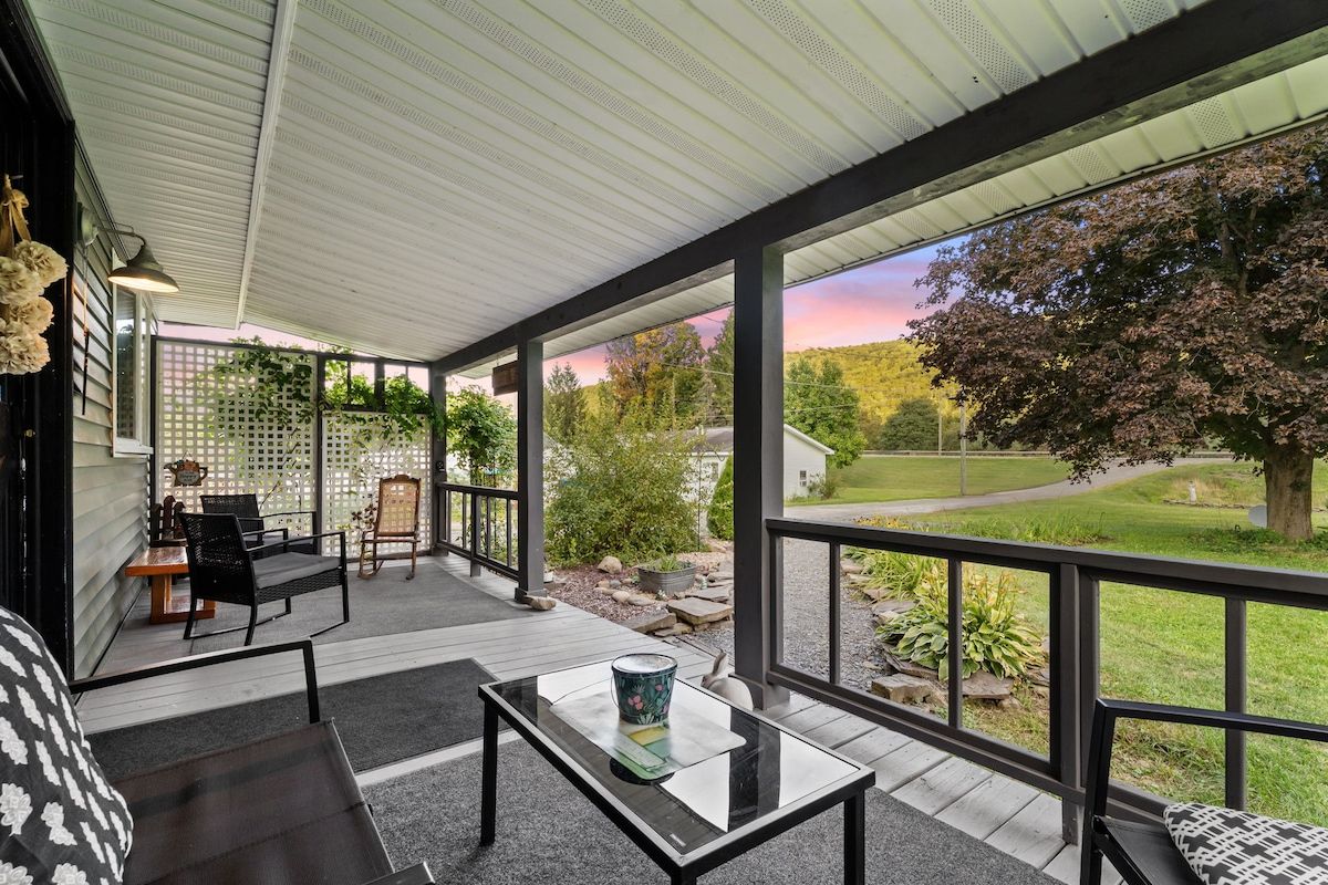 Breathe in the country air from this peaceful porch. With comfy seating, garden views, and plenty of shade, it’s perfect for morning coffee, afternoon chats, or winding down under the Finger lakes sky.