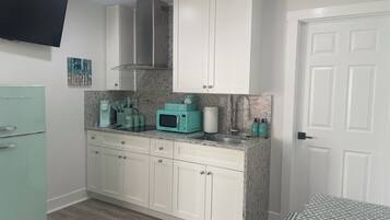 Fridge, microwave, stovetop, coffee/tea maker