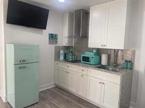 Fridge, microwave, stovetop, coffee/tea maker