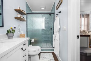 Shower, hair dryer, towels, soap