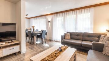 Comfort Condo, Balcony, Mountain View | Living area | 42-inch flat-screen TV with cable channels