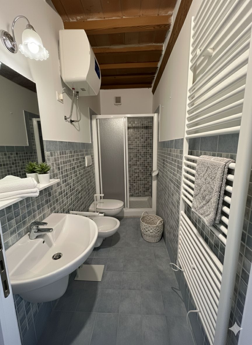 Un bagno moderno con un lavandino capiente, due servizi igienici, una doccia e un porta asciugamani.