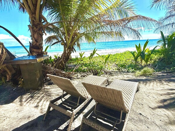 On the beach, sun loungers, beach towels