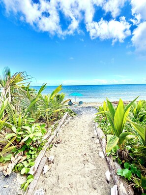 On the beach, sun loungers, beach towels