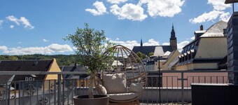 Rooftop suite with private sauna above the rooftops of Schneeberg