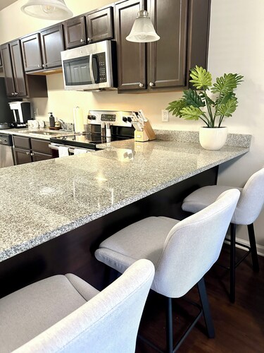 Walk to Stadium & Cotton District • 2 Parking Spots + Balcony & Pool