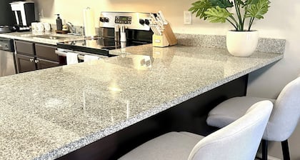 Walk to Stadium & Cotton District • 2 Parking Spots + Balcony & Pool