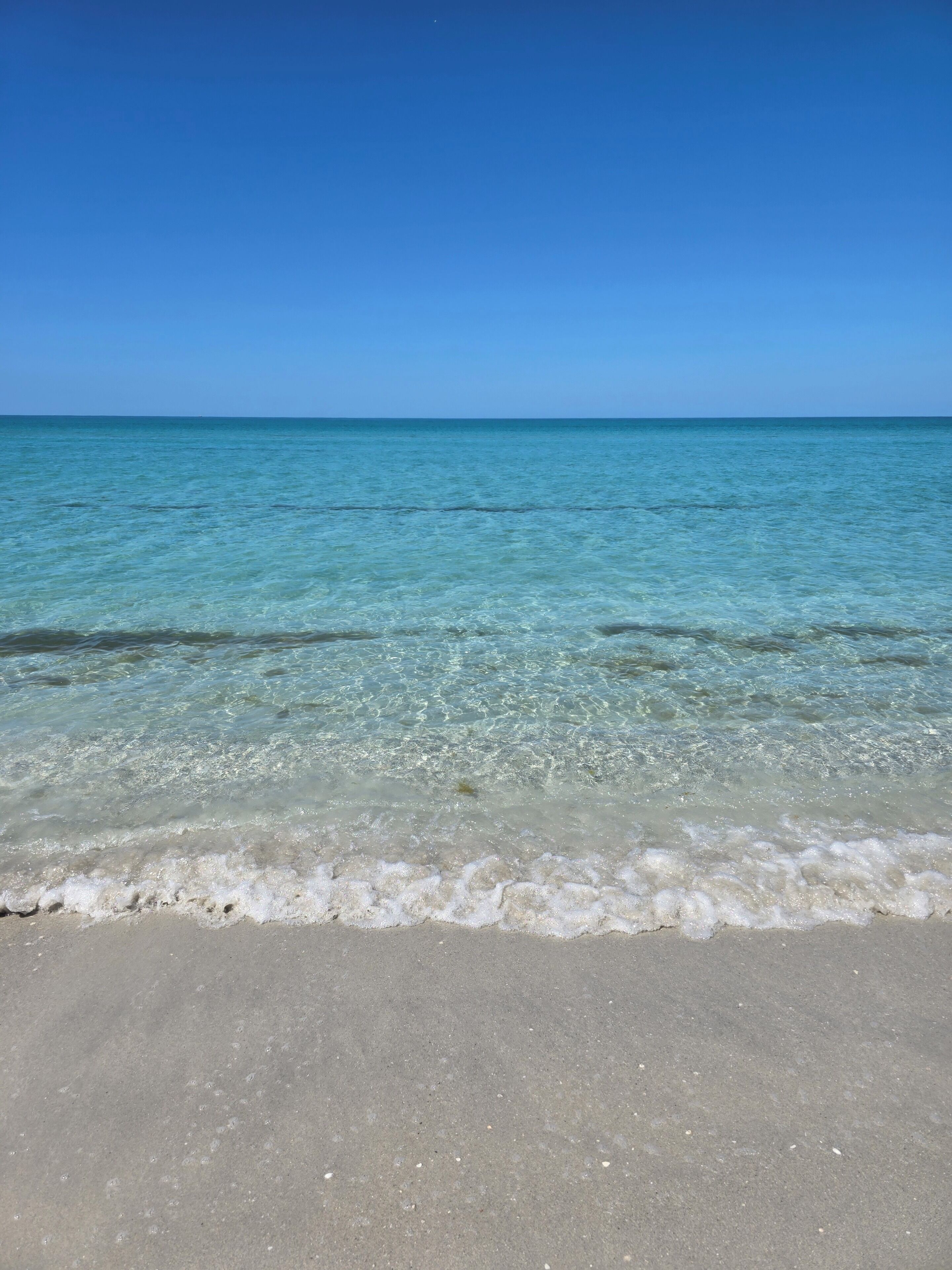 On the beach, sun loungers, beach towels