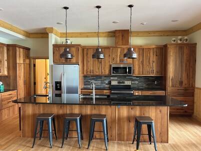 The Canopy with a wall of windows overlooking Big Sand Lake.