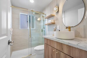 Shower, hair dryer, towels, soap