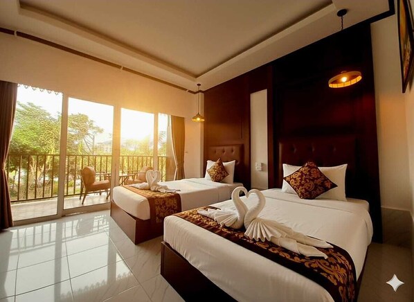 Deluxe Double or Twin Room, River View | In-room safe, desk, laptop workspace, blackout drapes