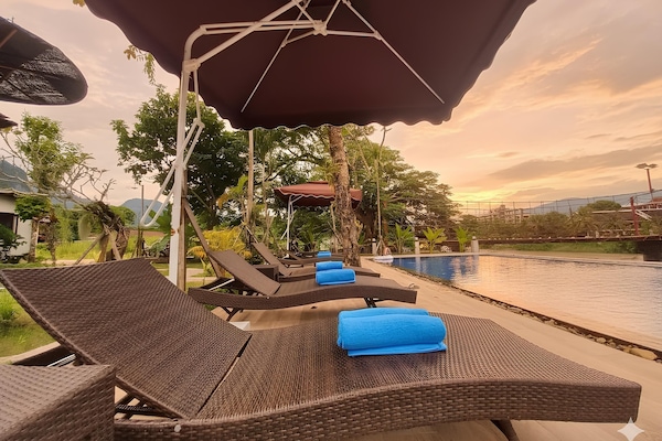 Outdoor pool, pool umbrellas, pool loungers