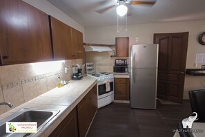 Fridge, microwave, stovetop, coffee/tea maker