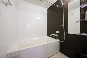 Combined shower/tub, free toiletries, hair dryer, slippers