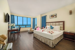 Deluxe Double Room, Beach View | Minibar, in-room safe, desk, laptop workspace