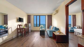 Family Quadruple Room, Beach View | Minibar, in-room safe, desk, laptop workspace