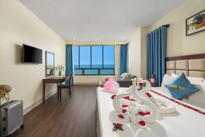 Deluxe Double Room, Beach View | Minibar, in-room safe, individually furnished, desk