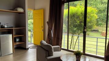 Deluxe Triple Room, Garden View | In-room safe, blackout drapes, free WiFi