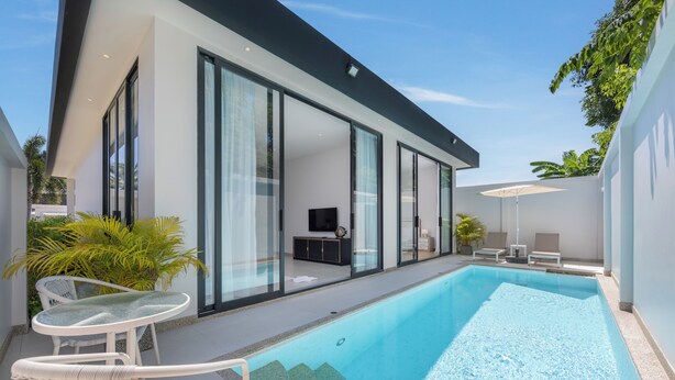 A modern house with a swimming pool, glass doors, and outdoor furniture. - Villa Noa  Modern 2BR with Private Pool (Rawai)