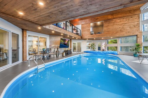 Indoor Heated Pool• Outdoor Hot Tub • Sports Building• 15 acres Woodlands