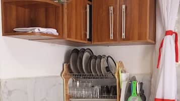 Family Bungalow, Garden View | Private kitchen | Fridge, microwave, cookware/dishes/utensils