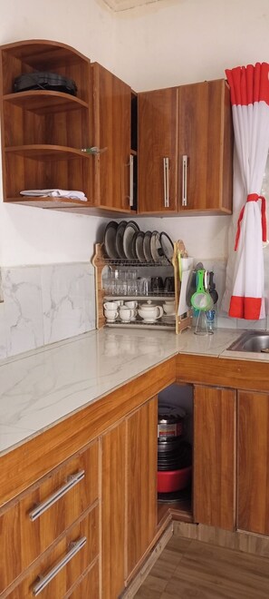Family Bungalow, Garden View | Private kitchen | Fridge, microwave, cookware/dishes/utensils