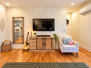 Farmhouse table with 55 inch TV in Living Room