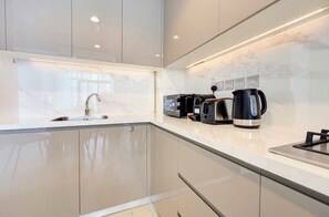 Deluxe Apartment, Balcony, Pool View | Private kitchen | Espresso maker, electric kettle