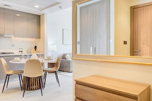 Deluxe Apartment, Balcony, Pool View | In-room dining