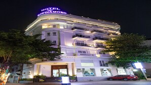 A multi-story hotel with a prominent neon sign reading "HOTEL BLUE DIAMOND". - Blue Diamond Airport Hotel (Ho Chi Minh City)