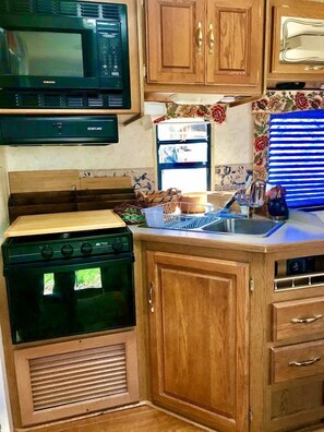 Fridge, microwave, stovetop, coffee/tea maker