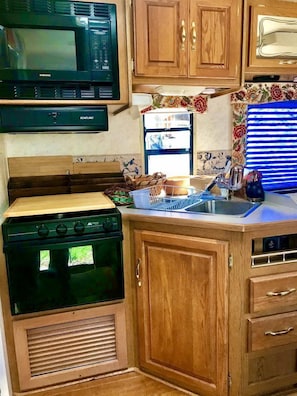 Fridge, microwave, stovetop, coffee/tea maker