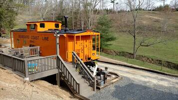A stationary train car with a platform and stairs, labeled 'SEABOARD COAST LINE.'