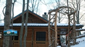 A wooden cabin with a sign reading 'Buffalo Bungalow.'