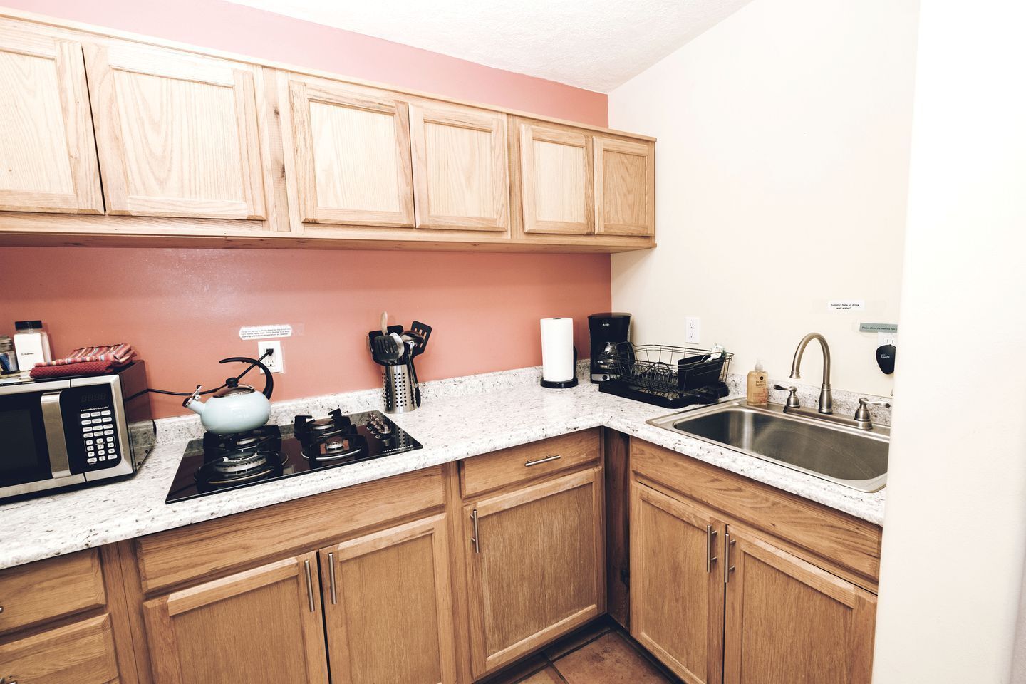 Fridge, stovetop, coffee/tea maker, cookware/dishes/utensils