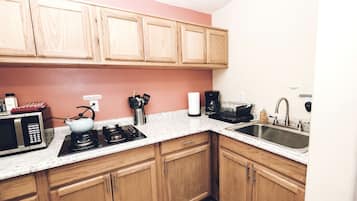 Fridge, stovetop, coffee/tea maker, cookware/dishes/utensils