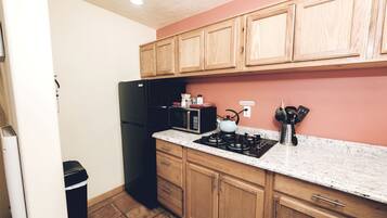 Fridge, stovetop, coffee/tea maker, cookware/dishes/utensils