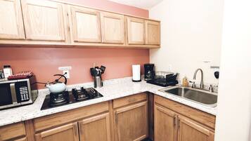 Fridge, stovetop, coffee/tea maker, cookware/dishes/utensils