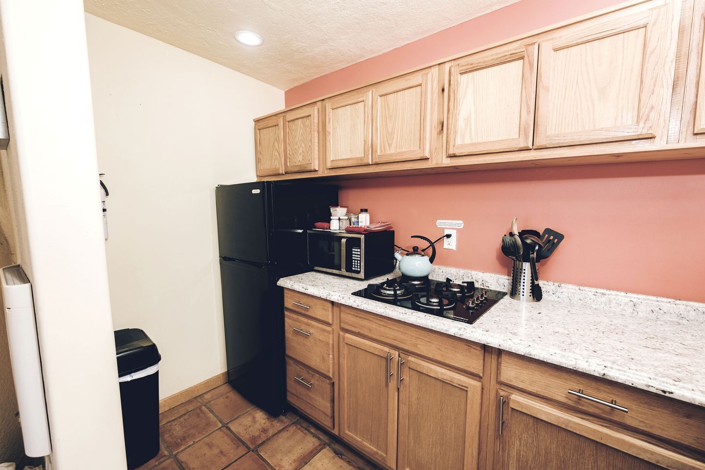 Fridge, stovetop, coffee/tea maker, cookware/dishes/utensils