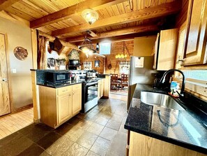Fridge, microwave, oven, stovetop - Charming Cabin Rental with a Hot Tub and Fireplace in the Smoky Mountains (Clyde)