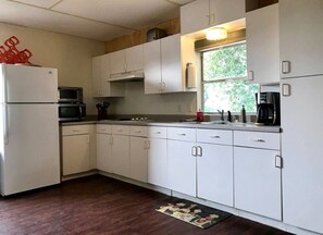 Fridge, microwave, stovetop, coffee/tea maker