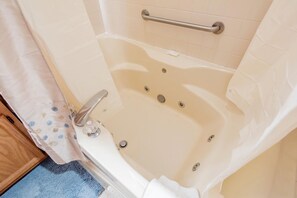 Jetted tub, hair dryer, towels, soap